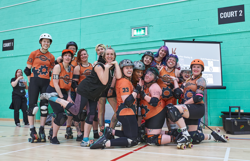 Our competitive team all gathered after a tough game. Despite being sweaty, the team are all smiles and poses, luring you in to try out the sport